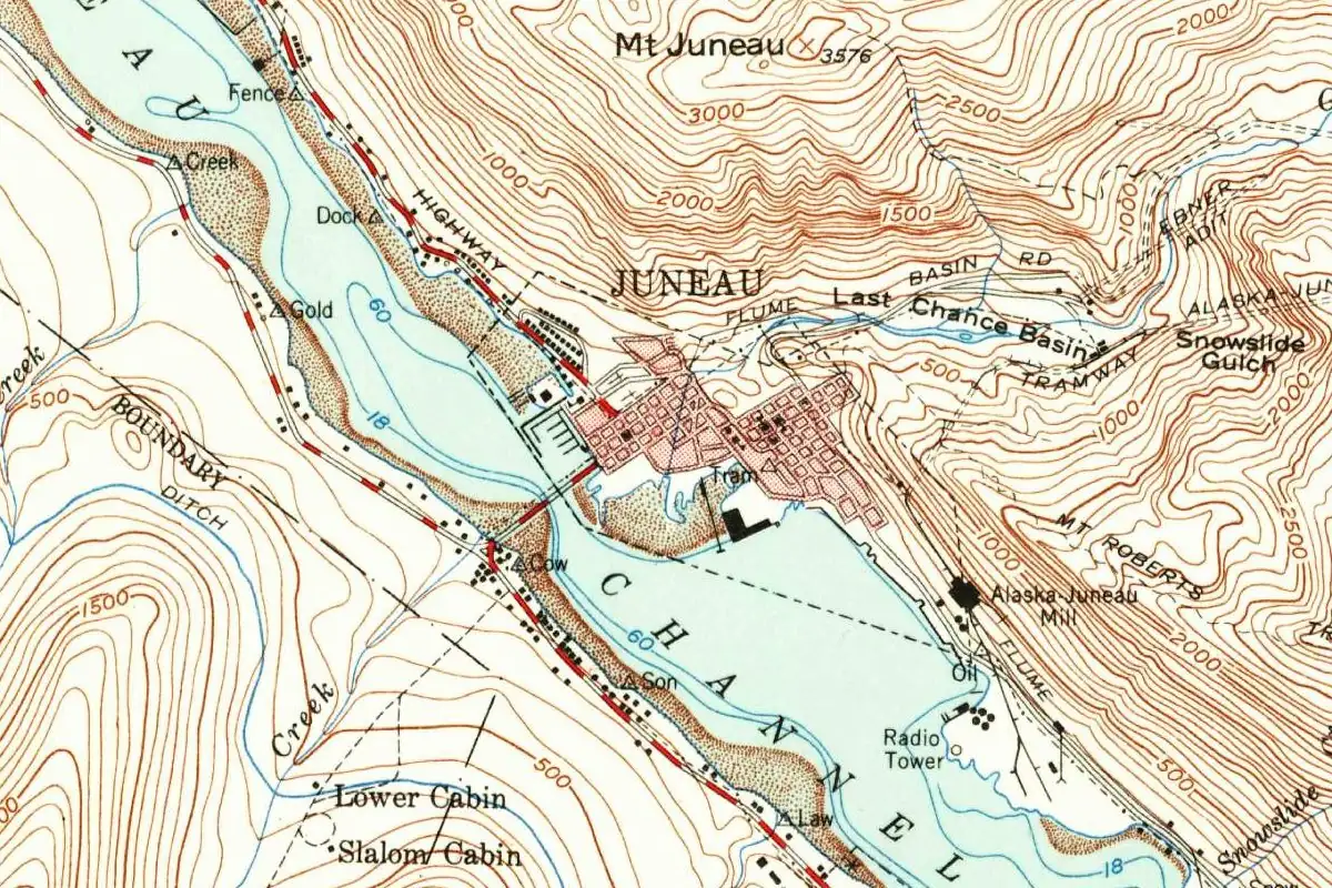 Detail of a mid-20th-century U.S. Geological Survey map showing the street grid of Juneau on Gastineau Channel, with Mount Juneau and Mount Roberts rising behind it