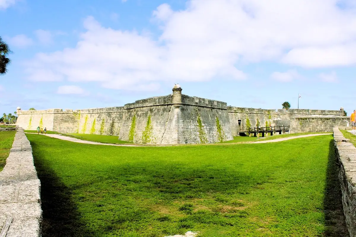 The low gray stone walls and corner watchtower of the Castillo de San Marcos in St. Augustine, Florida, the oldest of the oldest cities in the United States on this page.