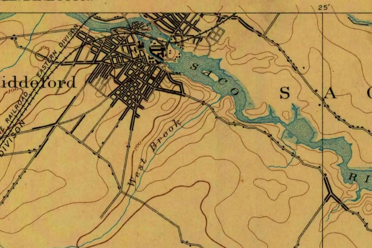 Detail of an 1891 U.S. Geological Survey map showing the Saco River winding between the street grid of Biddeford and the southern streets of Saco on the opposite bank, with the name Saco printed in large spaced letters on the Saco side