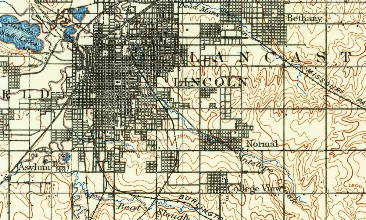 Detail of an 1897 U.S. Geological Survey map showing the dense street grid of Lincoln, with Lincoln Salt Lake to the northwest and the county name, Lancaster, lettered across the map