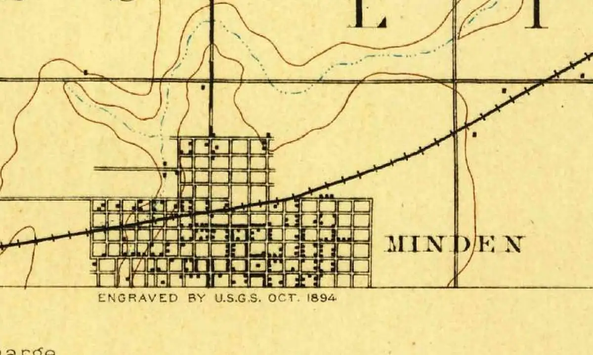 Detail of an 1894 U.S. Geological Survey map showing the street grid of Minden with a railroad crossing it, right at the bottom edge of the sheet
