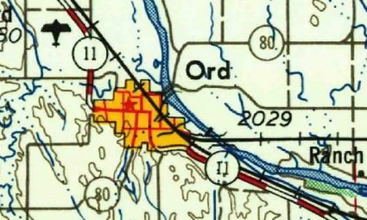 Detail of a 1955 U.S. Geological Survey map showing Ord in yellow beside the North Loup River, with Highway 11 and the railroad running past town