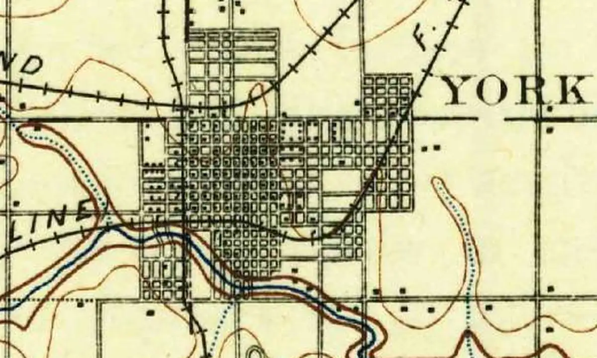 Detail of an 1898 U.S. Geological Survey map showing the street grid of York, with several railroad lines meeting in town and a creek winding along its south side