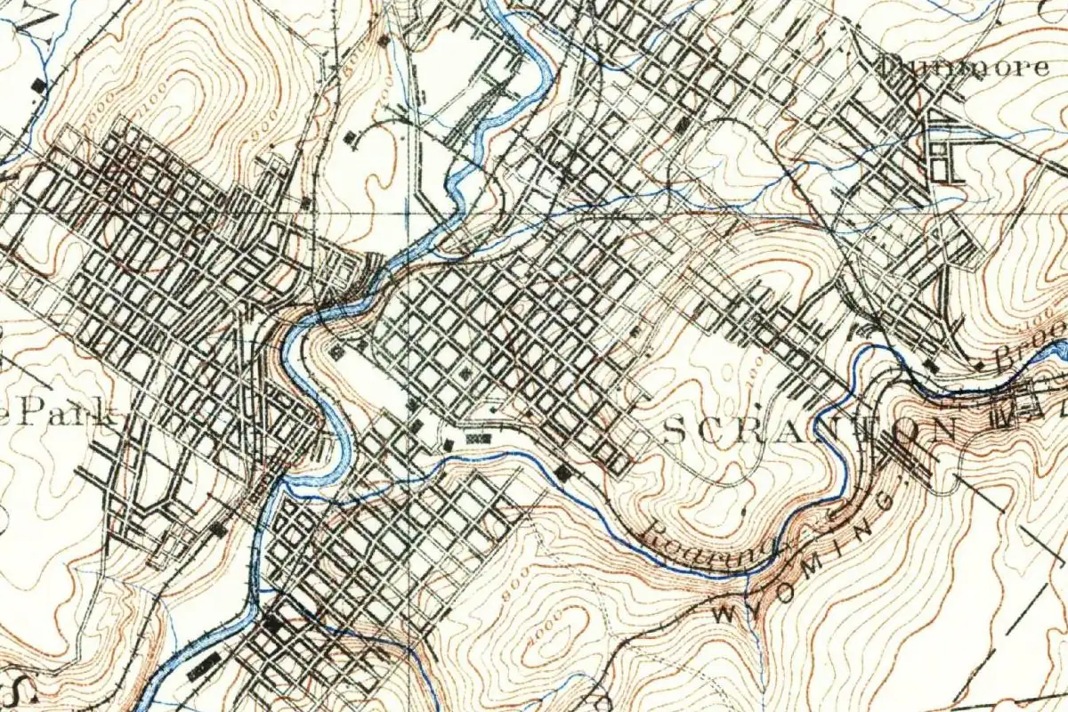 Detail of an 1891 U.S. Geological Survey map showing the dense street grid of Scranton on both sides of a winding river, with Hyde Park to the west, Dunmore to the northeast and Roaring Brook to the south