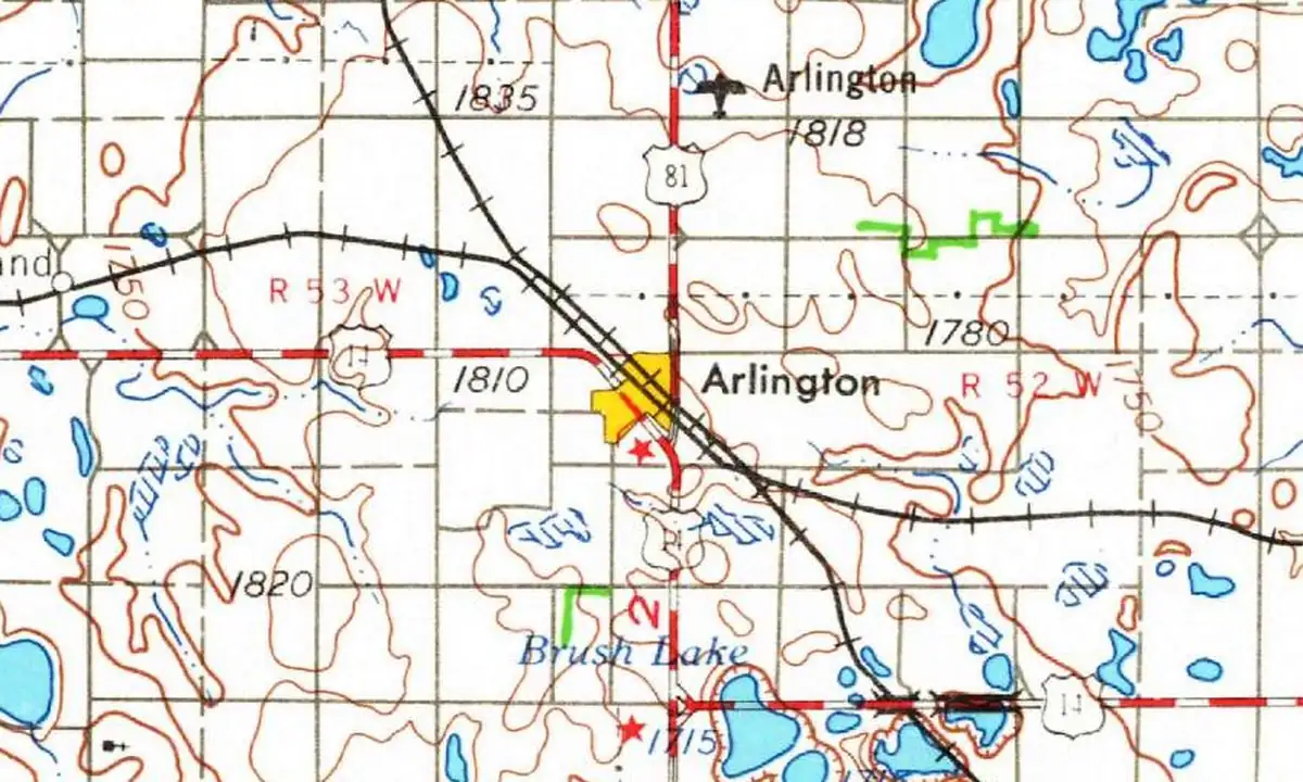 Detail of a 1953 U.S. Geological Survey map showing the town of Arlington where two railroad lines meet, with U.S. 81 and U.S. 14 and many small prairie lakes around it