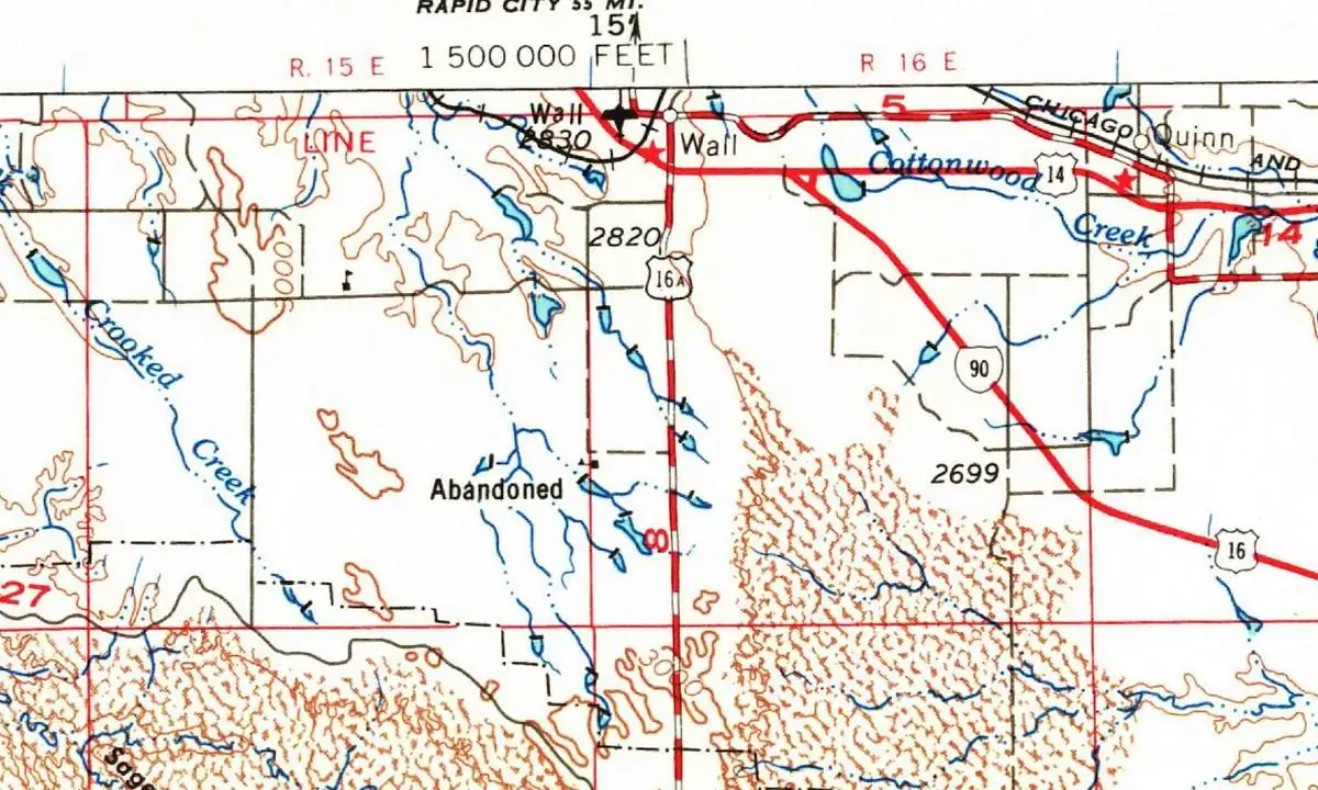 Detail of a 1955 U.S. Geological Survey map with the town of Wall at the top edge, the railroad and U.S. 14 running past it, and Cottonwood Creek to the east
